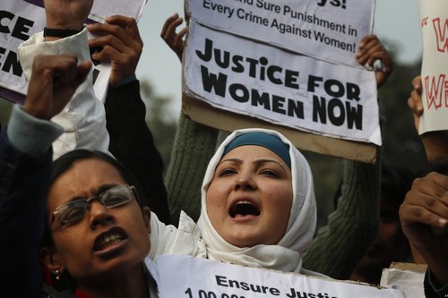 Indian women shout slogans as they protest against a recent gang-rape of a young woman in a moving bus in New Delhi, India, Thursday, Dec. 27, 2012. Indian Prime Minister Manmohan Singh pledged Thursday to take action to protect the nation's women while the young rape victim was flown to Singapore for treatment of severe internal injuries. (AP Photo/ Saurabh Das)